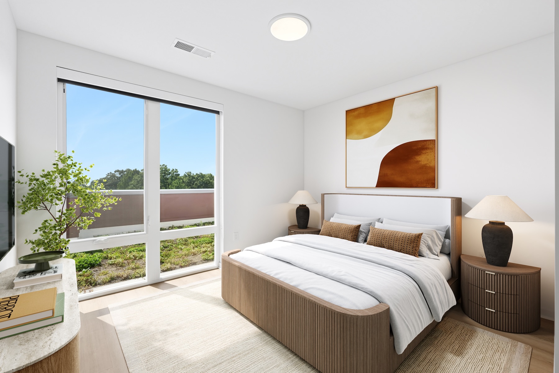 a bedroom with a bed and two nightstands