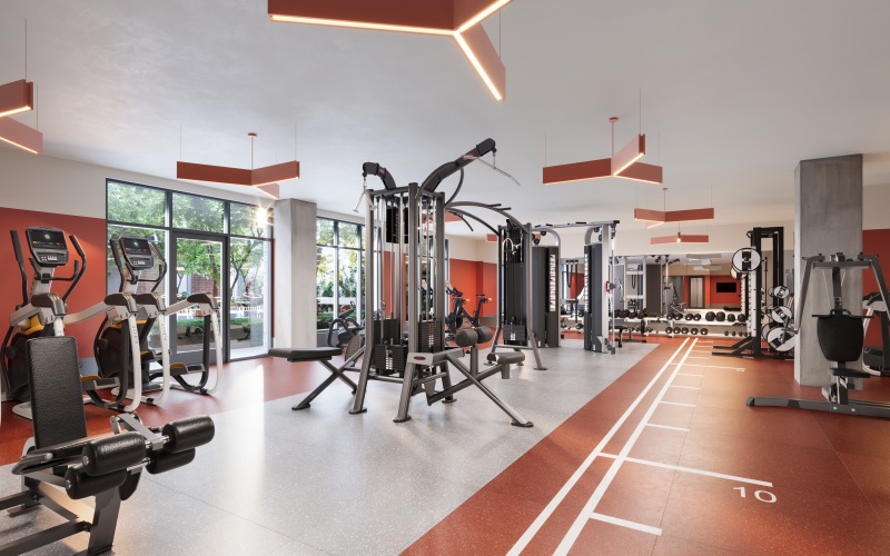 Fitness center with floor to ceiling windows and ceiling fans