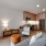 Model studio apartment at The Glade on Laurel Apartments in Washington DC, featuring wood grain floor paneling.
