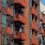 an apartment complex with orange balconies