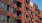 an apartment complex with orange balconies