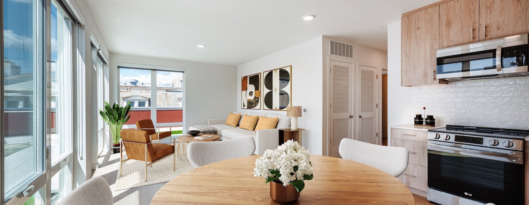 a kitchen with a dining table and chairs