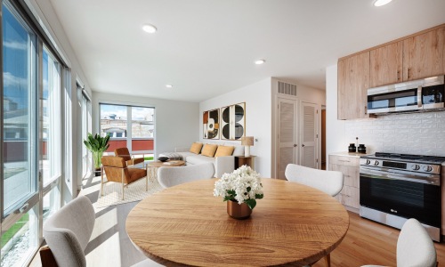 a kitchen with a dining table and chairs