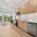 open kitchen with steel appliances and wood cabinets