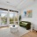 living room with large windows and green couch