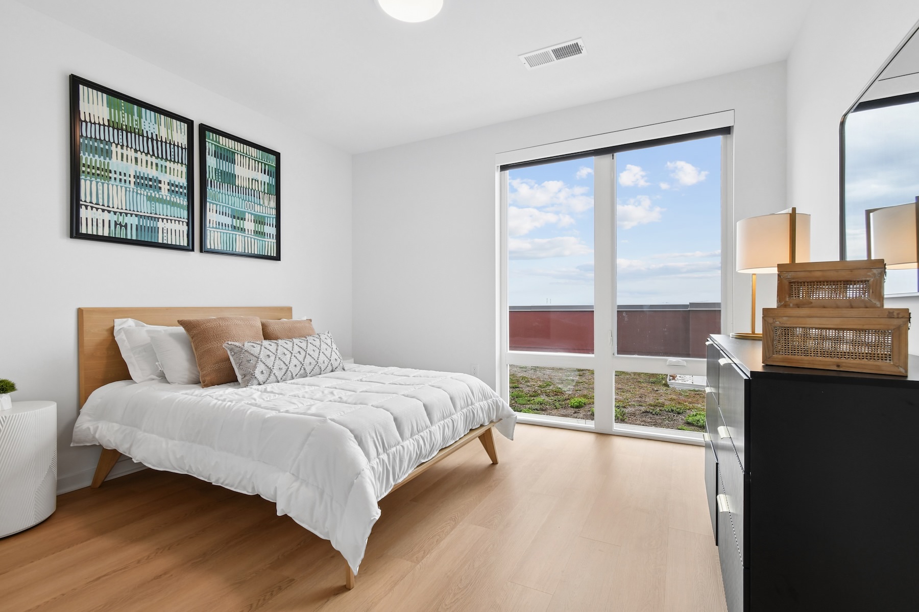 a bedroom with large windows